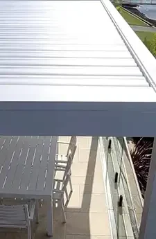 Patio space fitted with sleek motorised shutters